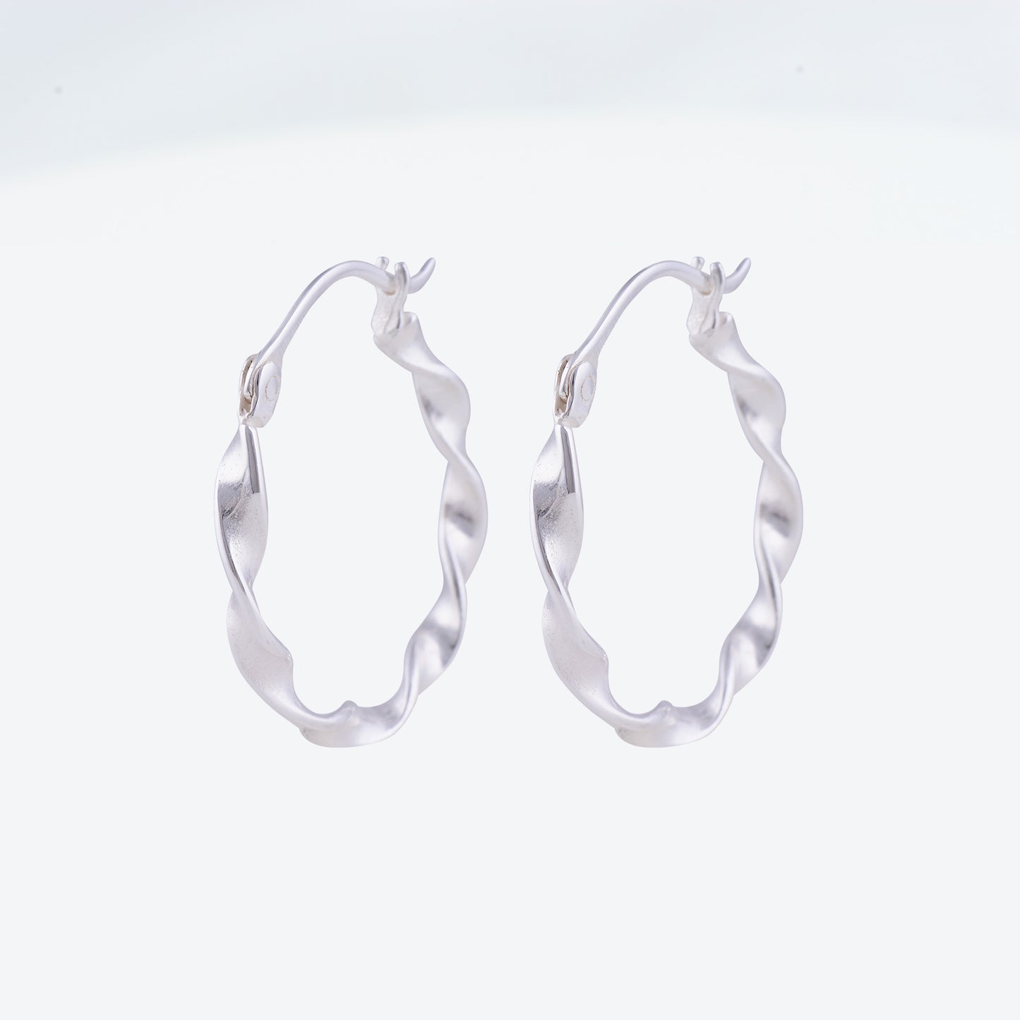 Twisted Hoop Earrings - 25 mm Silver